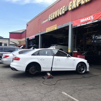 Tire 4 Less - Changing tires on a jack. Over torquing lug-nuts - Auto Repair Near Me - La Crescenta-Montrose, California Tire 4 Less - Changing tires on a jack. Over torquing lug-nuts - Auto Repair Near Me - La Crescenta-Montrose, California