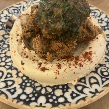 Tavi - Hummus and fried chicken with delicious chutney (maybe) sauce on top. Hummus is delightfully creamy - Middle Eastern Near Me - Covington, Louisiana Tavi - Hummus and fried chicken with delicious chutney (maybe) sauce on top. Hummus is delightfully creamy - Middle Eastern Near Me - Covington, Louisiana