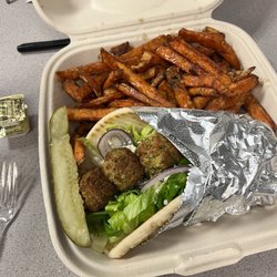 Souvlaki wrap with falafel and sweet potatoes fries