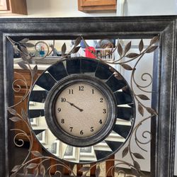 Coastal Cottage Consignment - Very old clock in large frame  with gold leaves, great condition.