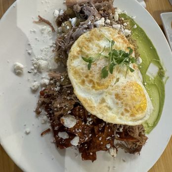 Early Bird - Half red half green chilaquiles with carnitas - New American Near Me - Fullerton, California Early Bird - Half red half green chilaquiles with carnitas - New American Near Me - Fullerton, California