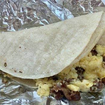 El Grande Taco - Outstanding Egg, bacon, and corn tortilla Breakfast Taco.  Very full taco, so satisfying, piping Hot! And that mild taco sauce, so good!! - Food Trucks Near Me - Kingsland, Texas