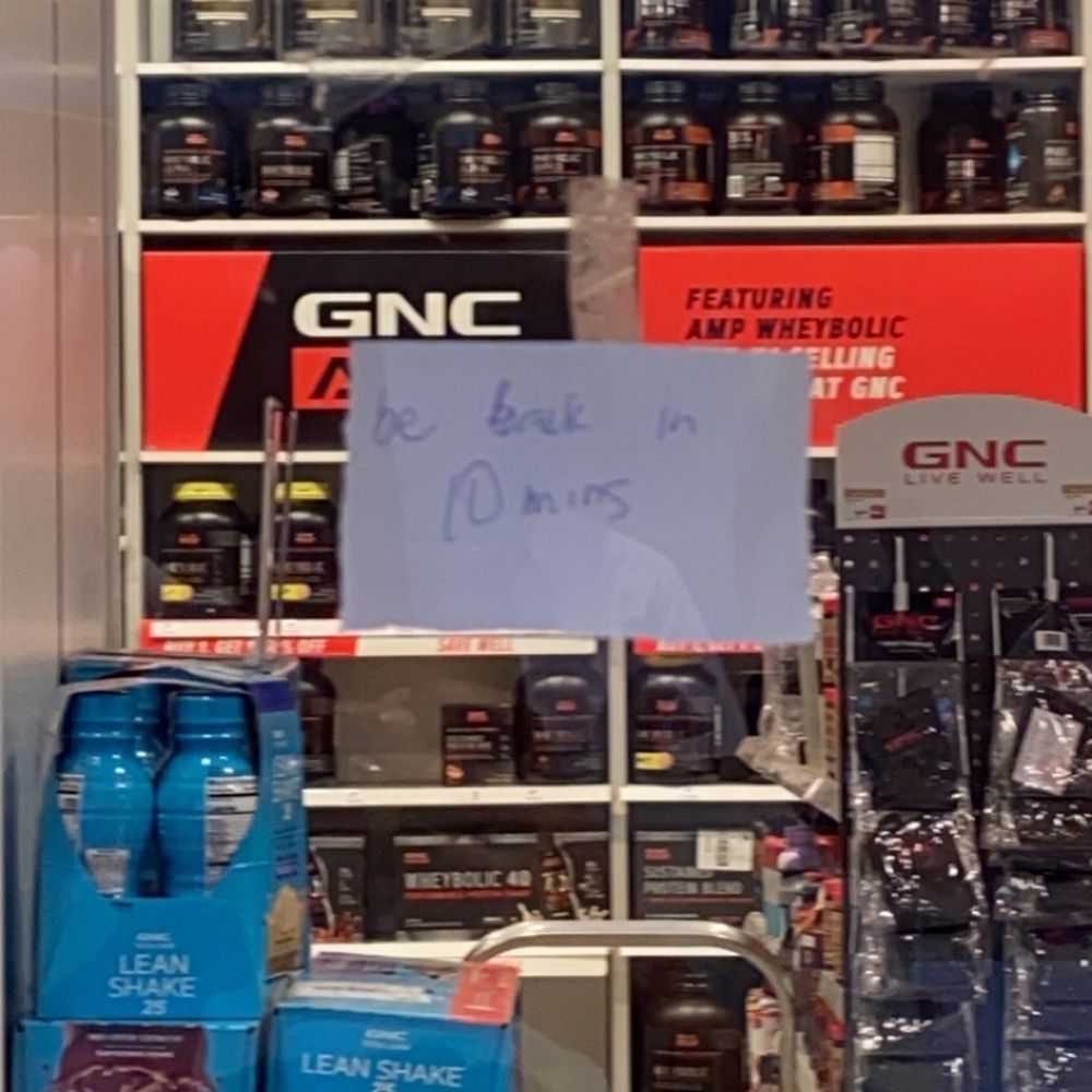GNC - a sign in a store window - Health Markets Near Me - Atlanta, Georgia