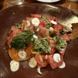 Vegan heirloom tomatoes with pesto and garlic