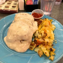 Biscuits and gravy with home fries. Biscuits and gravy with home fries.