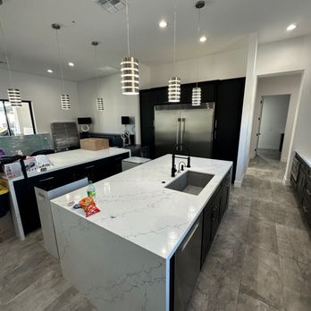 Exact Construction and Restoration - a kitchen with a large island - General Contractors Near Me - Gilbert, Arizona