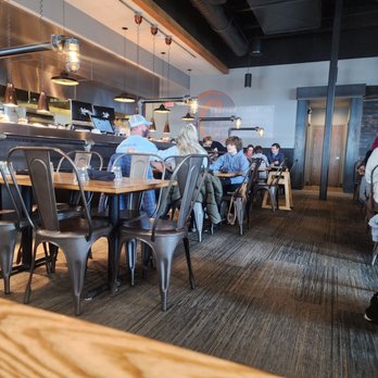 Charred - people sitting at tables in a restaurant - Pizza Near Me - Midlothian, Virginia Charred - people sitting at tables in a restaurant - Pizza Near Me - Midlothian, Virginia