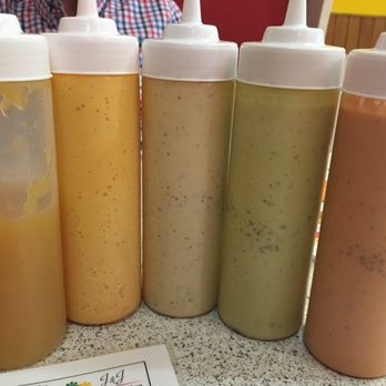 Este's Mucho Perro - You had me at hello sauces! Not sure what they all are, but all are good. L-R pineapple, ?, ranch, garlic & ? - Hot Dogs Near Me - Pembroke Pines, Florida Este's Mucho Perro - You had me at hello sauces! Not sure what they all are, but all are good. L-R pineapple, ?, ranch, garlic & ? - Hot Dogs Near Me - Pembroke Pines, Florida