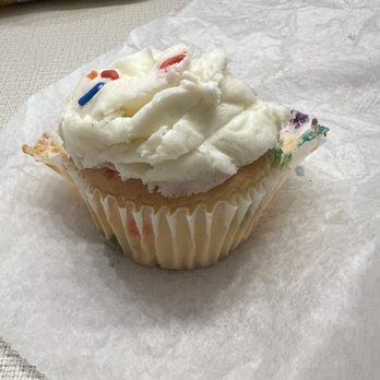 Mr Natural - My half of the confetti cupcake. Frosting is out of this world. - Vegetarian Near Me - Austin, Texas