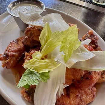 58 Social - Crispy Chicken Wings. Citrus herb marinade and buffalo style glaze, blue cheese or roquefort dressing. - Pubs Near Me - San Francisco, California