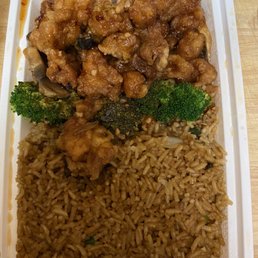 a container of rice, broccoli, and chicken a container of rice, broccoli, and chicken