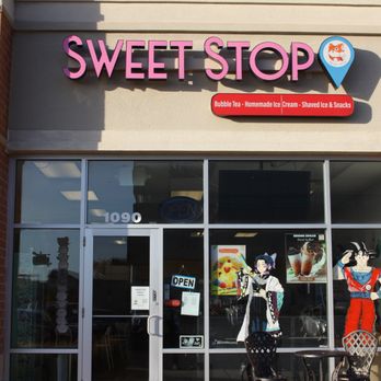 Sweet Stop - Front of store. Art on windows done by AranPaintz - Desserts Near Me - Geneva, Illinois