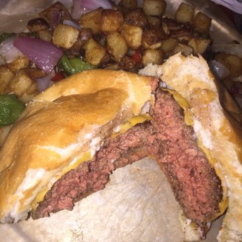 The Hound - The Hound Burger. Perfectly cooked and juicy. Side of breakfast potatoes. - New American Near Me - Auburn, Alabama The Hound - The Hound Burger. Perfectly cooked and juicy. Side of breakfast potatoes. - New American Near Me - Auburn, Alabama