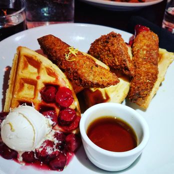 Modern Love Brooklyn - Seitan and waffles with cherry pie filling and lemon butter. The waffle was a bit on the hard side, but overall a tasty bite. - Vegan Near Me - Brooklyn, New York