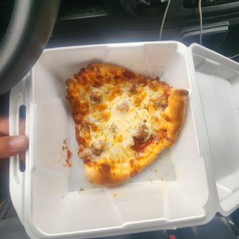 Mama K's Pizza and Grille - Slice of sausage pizza with undercooked dough - Pizza Near Me - Gurnee, Illinois Mama K's Pizza and Grille - Slice of sausage pizza with undercooked dough - Pizza Near Me - Gurnee, Illinois