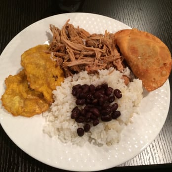 Senor Pan Cafe - Fullerton - A delicious plate of lechon with white rice, black beans, tostones and empanadas. - Cuban Near Me - Chicago, Illinois Senor Pan Cafe - Fullerton - A delicious plate of lechon with white rice, black beans, tostones and empanadas. - Cuban Near Me - Chicago, Illinois
