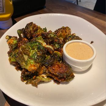 Yard House - Not only did the Brussel Sprouts have some type of dressing on them, the SAUCE it came with was delish. - New American Near Me - Austin, Texas
