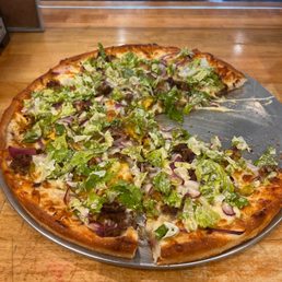"Big Mac" Pizza: Burger, Pickles, Onions, Thousand Island made in-house, garnished with Lettuce "Big Mac" Pizza: Burger, Pickles, Onions, Thousand Island made in-house, garnished with Lettuce