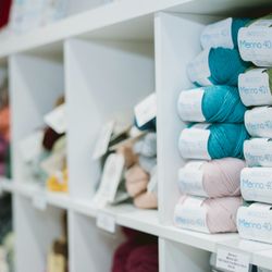 AriYARN Shop and Studio - Soft and versatile Berroco Merino 401 yarn beautifully organized by color at AriYARN in Park Ridge--ideal for cozy handmade creations