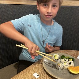 Son had sushi for the first time he loved it !