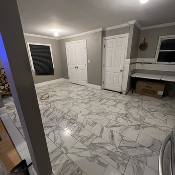 T.N.T. CONTRACTORS - a room with a marble floor - General Contractors Near Me - Farmingdale, New York T.N.T. CONTRACTORS - a room with a marble floor - General Contractors Near Me - Farmingdale, New York