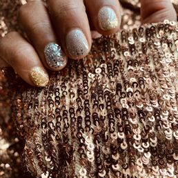 Individually dipped nails in gold, rose gold, and silver.