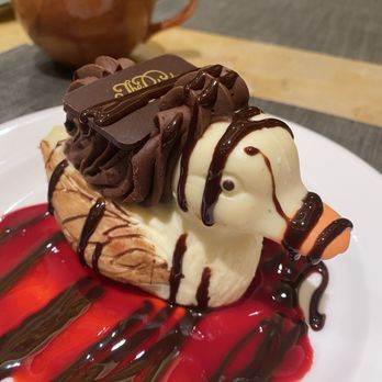 Capriccio Grill - Peabody White Chocolate Duck stuffed w/dark chocolate moose in stream of raspberry coulis. Moi fave dessert of all time OuiOui. - Steakhouses Near Me - Memphis, Tennessee
