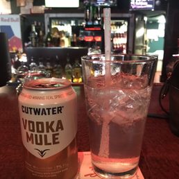 a glass of vodka and a can of vodka a glass of vodka and a can of vodka