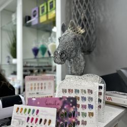 Alo Nail Lounge - Front desk with various nail options