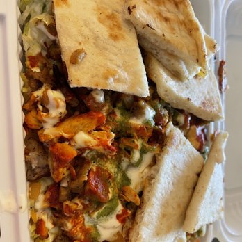 Farook Halal Food - Combination over rice. White, red and green sauce - Halal Near Me - New York, New York Farook Halal Food - Combination over rice. White, red and green sauce - Halal Near Me - New York, New York