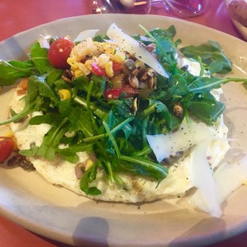 Snooze, an A.M. Eatery - Egg White Frittata. It's topped with dressed arugula, tomatoes, pepitas, a little manchengo cheese, and some roasted corn. Delicious! - Breakfast & Brunch Near Me - Tempe, Arizona Snooze, an A.M. Eatery - Egg White Frittata. It's topped with dressed arugula, tomatoes, pepitas, a little manchengo cheese, and some roasted corn. Delicious! - Breakfast & Brunch Near Me - Tempe, Arizona