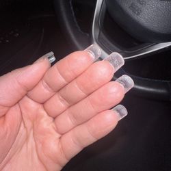 Angel Tips Nail Salon - All the glue build up under my nail. The picture doesn't even fully show the glue because it's clear