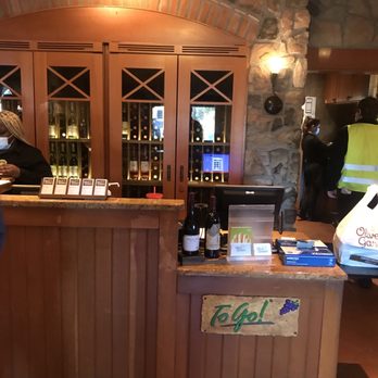 Olive Garden Italian Restaurant - a counter with bottles of wine - Italian Near Me - Florence, South Carolina