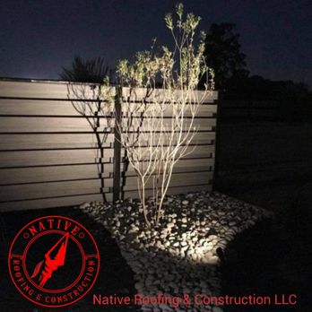 Native Construction & Roofing - a tree lit up at night - Roofing Near Me Native Construction & Roofing - a tree lit up at night - Roofing Near Me