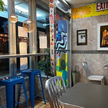 Patacon Pisao - a table and chairs in a restaurant - Venezuelan Near Me - Elmhurst, New York Patacon Pisao - a table and chairs in a restaurant - Venezuelan Near Me - Elmhurst, New York