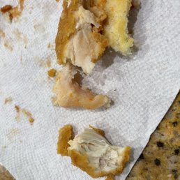 That is raw chicken meat in the sandwich i Ordered for my child. That is raw chicken meat in the sandwich i Ordered for my child.