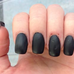 Nail Studio - Second finger crooked, top coat missed in streaks.