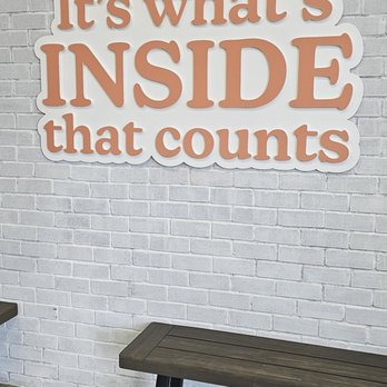 Dirty Dough-Blue Ash - two benches in front of a brick wall that says it's what's inside that counts - Desserts Near Me - Blue Ash, Ohio Dirty Dough-Blue Ash - two benches in front of a brick wall that says it's what's inside that counts - Desserts Near Me - Blue Ash, Ohio