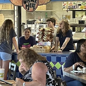 Mellow Mushroom - Staff having a visit while customers wait to be seated. (There were two more staff members off to the side, not in the photo.) - Pizza Near Me - Conyers, Georgia