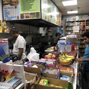 Photo of Mott Corner - New York, NY, United States. The kitchen cooking up our burgers and fries!