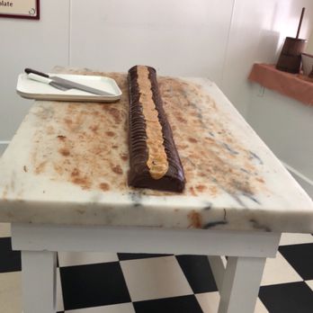 Joann's Fudge - A slab of double dark caramel before slicing - Candy Stores Near Me - Mackinac Island, Michigan