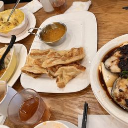 Assortment of dishes: Malaysian flat bread (Roti), fish (right), yin yang baked rice, Portuguese chicken rice. Assortment of dishes: Malaysian flat bread (Roti), fish (right), yin yang baked rice, Portuguese chicken rice.