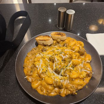Flor de Caña Eatery & Bar - Potato gnocchi with creamy bolognese, really salty for some reasons - Breakfast & Brunch Near Me - Caguas, Puerto Rico