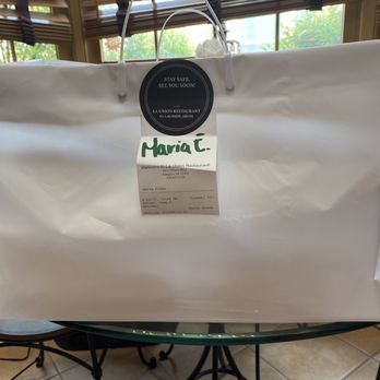 La Union Restaurant - a white shopping bag on a table - Mexican Near Me - Arlington, Virginia La Union Restaurant - a white shopping bag on a table - Mexican Near Me - Arlington, Virginia