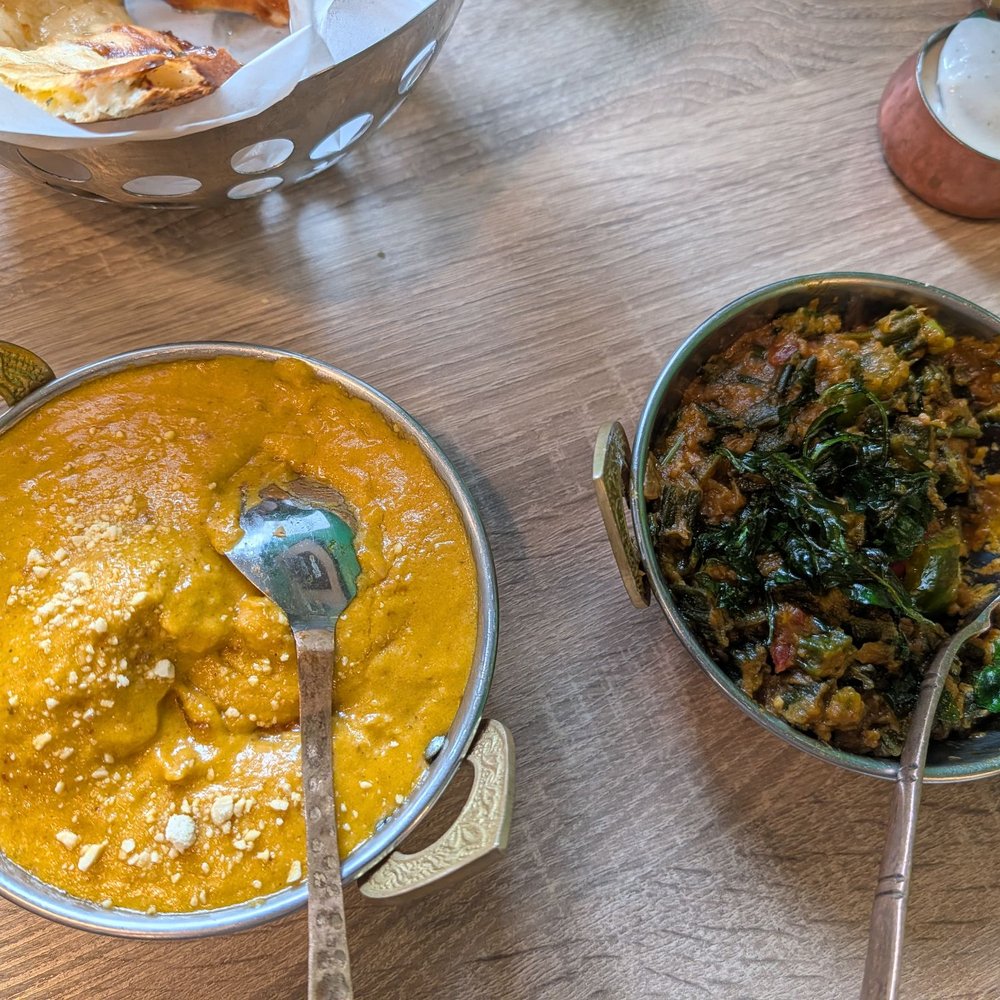 Malai kofta (left), bindhi masala (right)