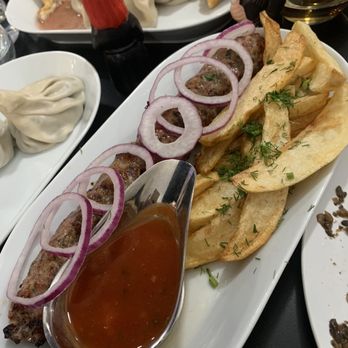 Sakartvelo - Lamb kebab ( mushroom dumplings on left- very large) - Georgian Near Me - Philadelphia, Pennsylvania Sakartvelo - Lamb kebab ( mushroom dumplings on left- very large) - Georgian Near Me - Philadelphia, Pennsylvania