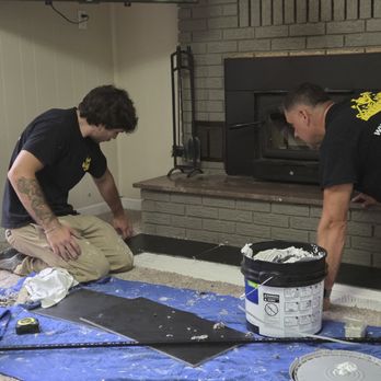 Golden Hands Construction - Level laying the tile - General Contractors Near Me Golden Hands Construction - Level laying the tile - General Contractors Near Me