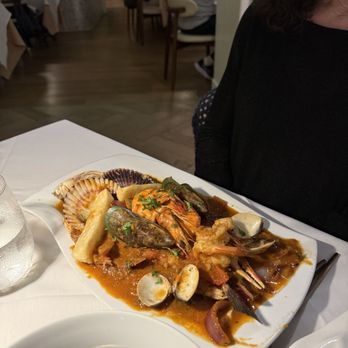 Nicola restaurant - Branzino topped with Scallops, Prawns, Crab, Mussels and Clams - Peruvian Near Me - San Luis, California Nicola restaurant - Branzino topped with Scallops, Prawns, Crab, Mussels and Clams - Peruvian Near Me - San Luis, California