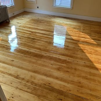 AJ Floor Service - AFTER in living room of barn wood floor restoration. They really took the time to set in all these nails of this rustic flooring - Flooring Near Me