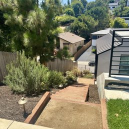 AFTER: accessible & well-lit staircase while retaining shrubbery along the side